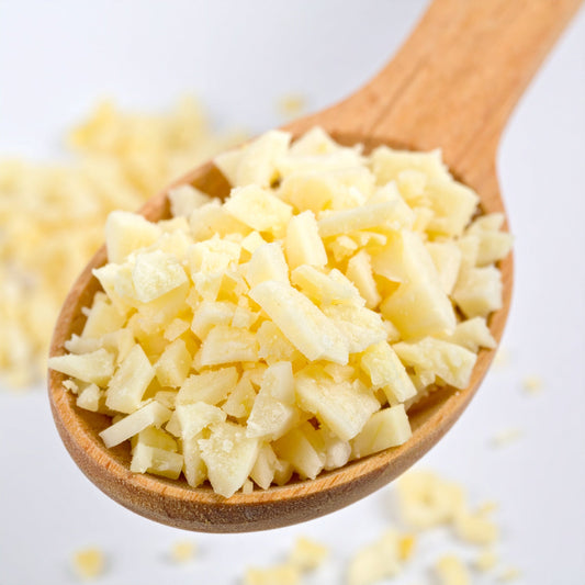 Finely Chopped Garlic on a wooden spoon