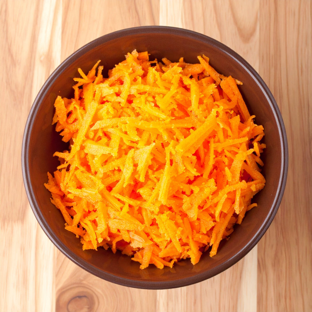 Grated Carrot in a brown bowl