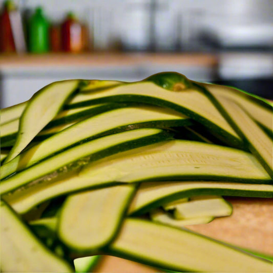 Long sliced green courgettes in a kitchen