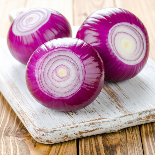 Peeled Red Onions on a Chopping Board