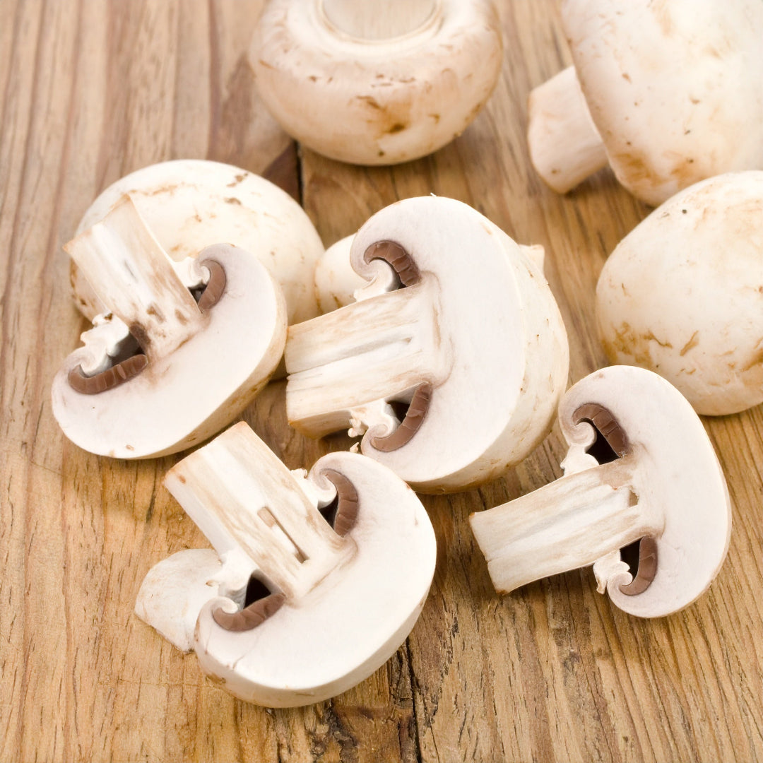 Sliced Mushrooms on a wooden table