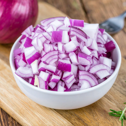 Diced Red Onions in a white bowl