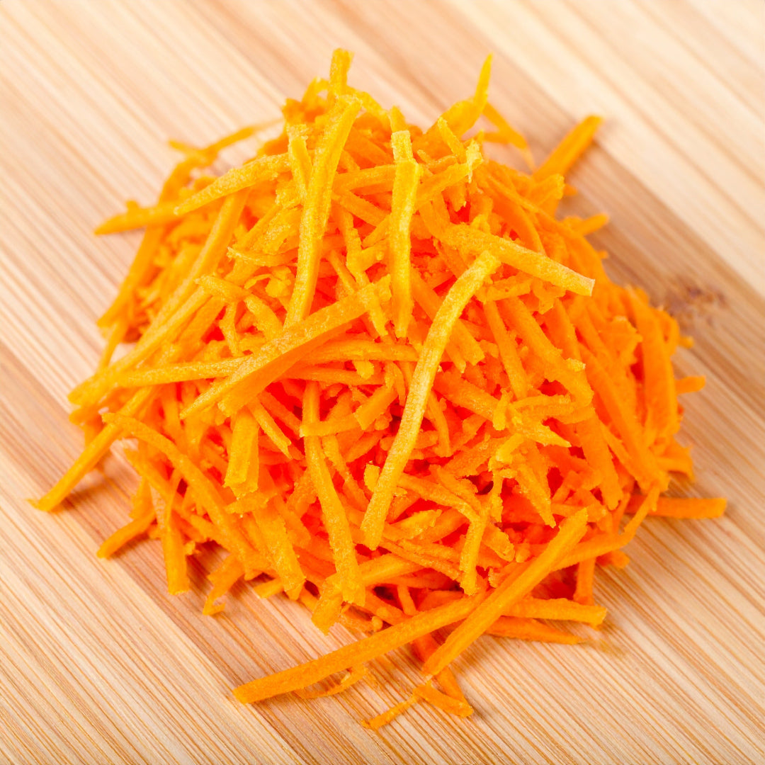 Grated Carrots on a chopping board