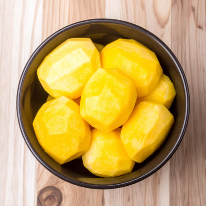 Peeled Gold Beetroot in a black bowl
