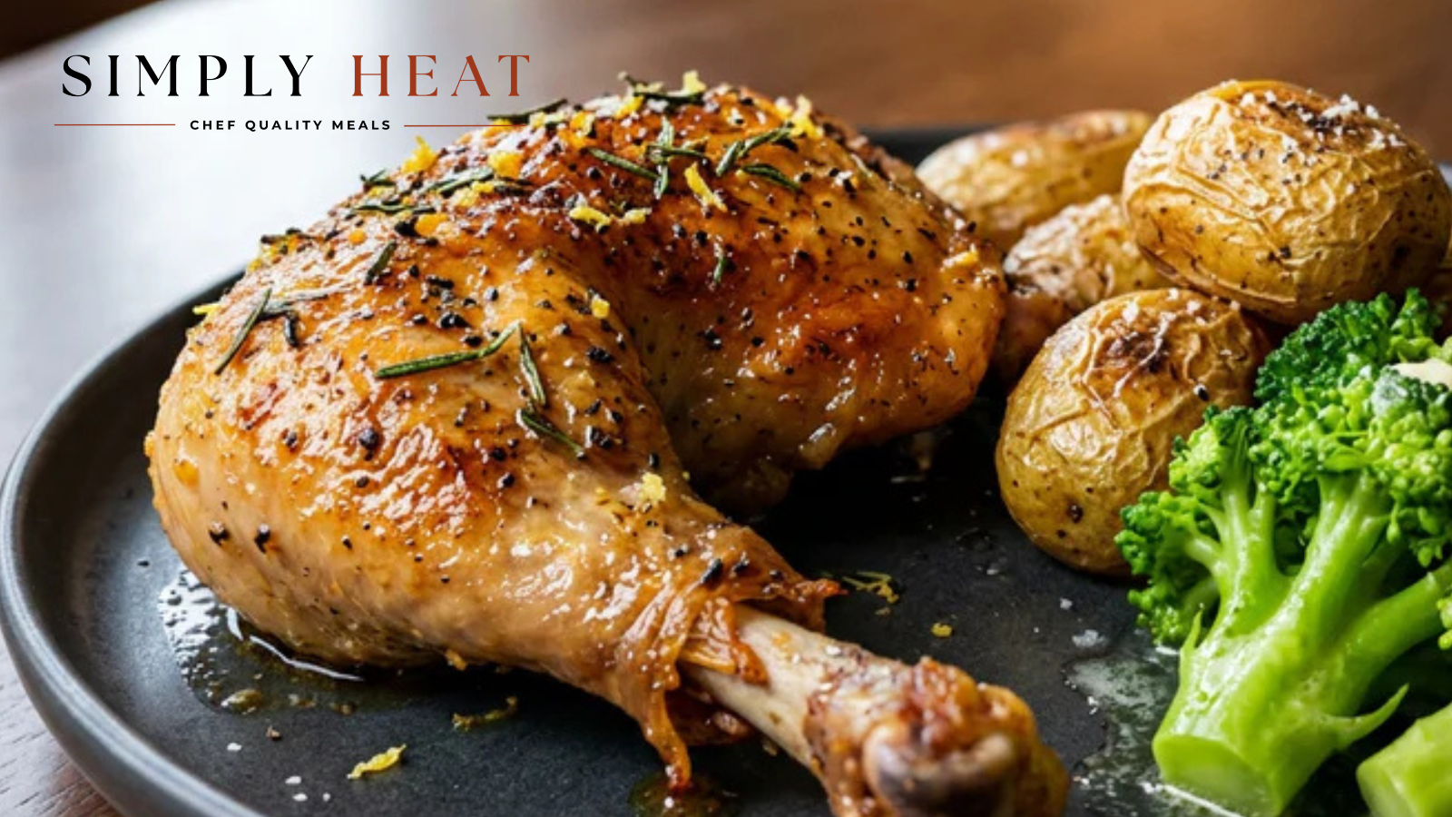 Roasted chicken leg with potatoes and broccoli on a plate, featuring 'Simply Heat' branding.