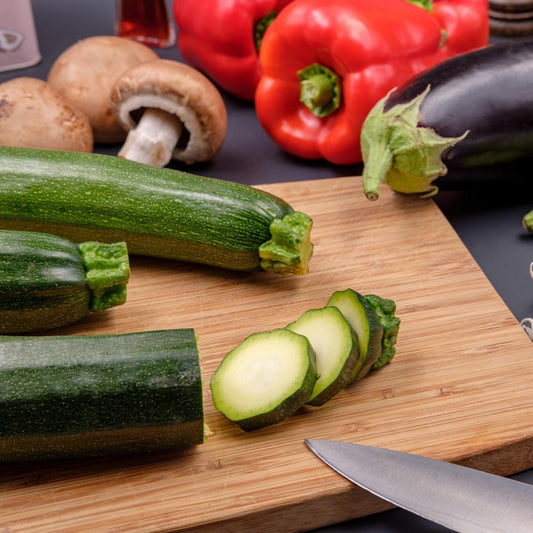 Sliced Courgettes on a wooden chopping board
