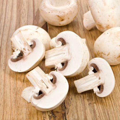 Sliced Mushrooms on a wooden table
