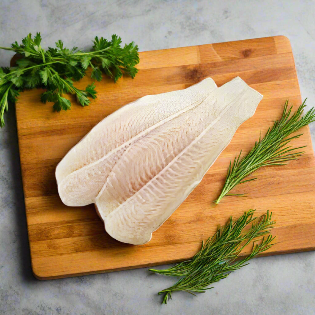Tarakihi Fillets on a chopping board surrounded by fresh herbs