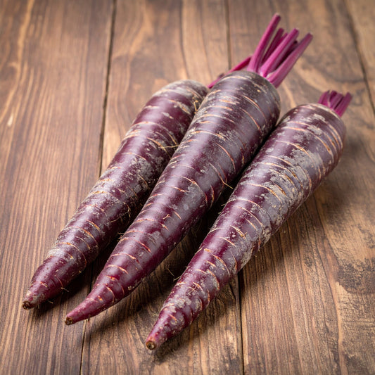 Whole Purple Carrots on a wooden table